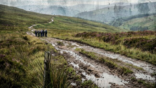 Digital artwork depicting a group of Muslim women trekking through a breath taking British landscape